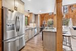 Stainless steel appliances in this fully stocked kitchen
